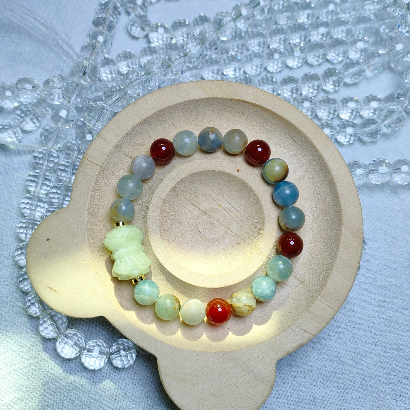 A lucky featuring blue calcite & carnelian & Xiuyan jade lotus spacer bracelet